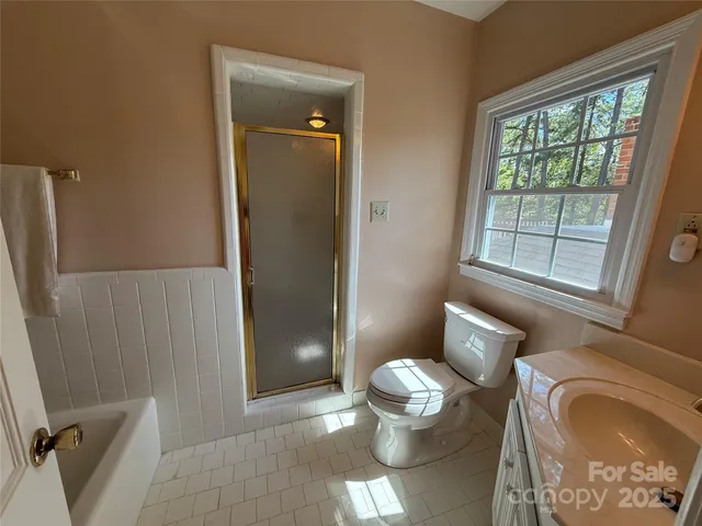 a bathroom with a toilet and a sink