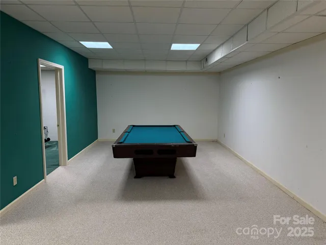 a room with table and bed