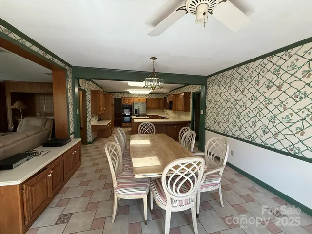 a dining room with furniture and window