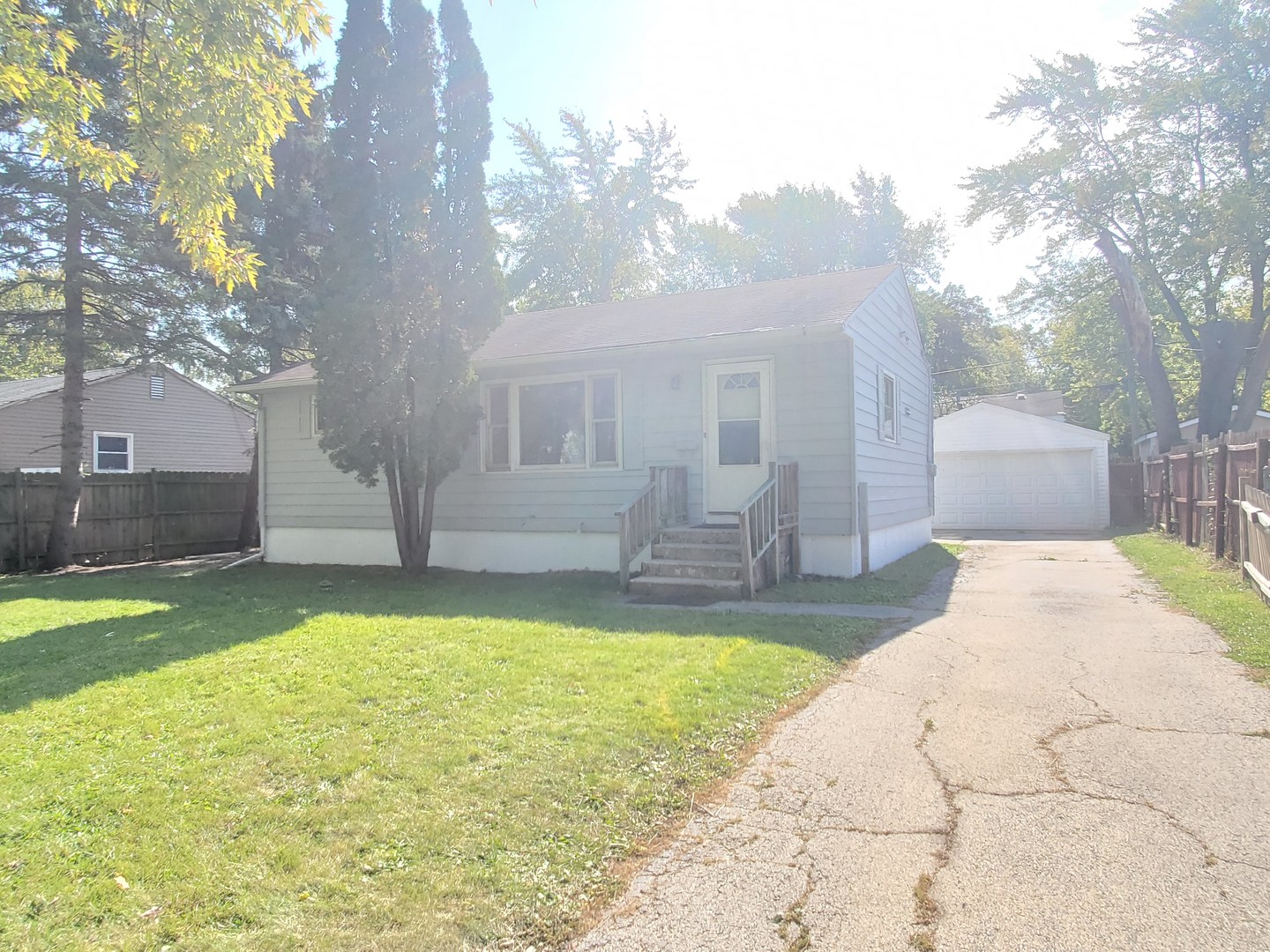 1657 Rice Street Waukegan, IL 60087 - Photo 1 of 10 a swimming pool with outdoor seating and yard