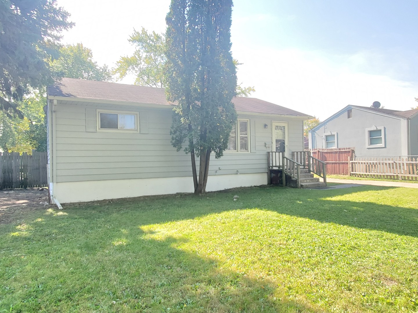 1657 Rice Street Waukegan, IL 60087 - Photo 2 of 10 a view of a house with a backyard