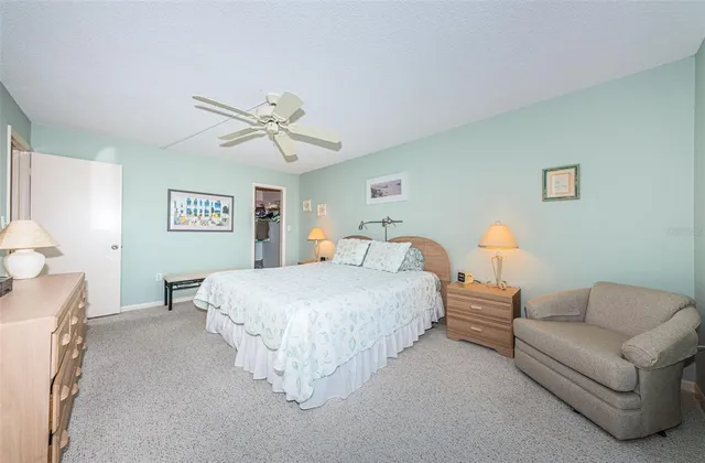 a spacious bedroom with a bed and a couch