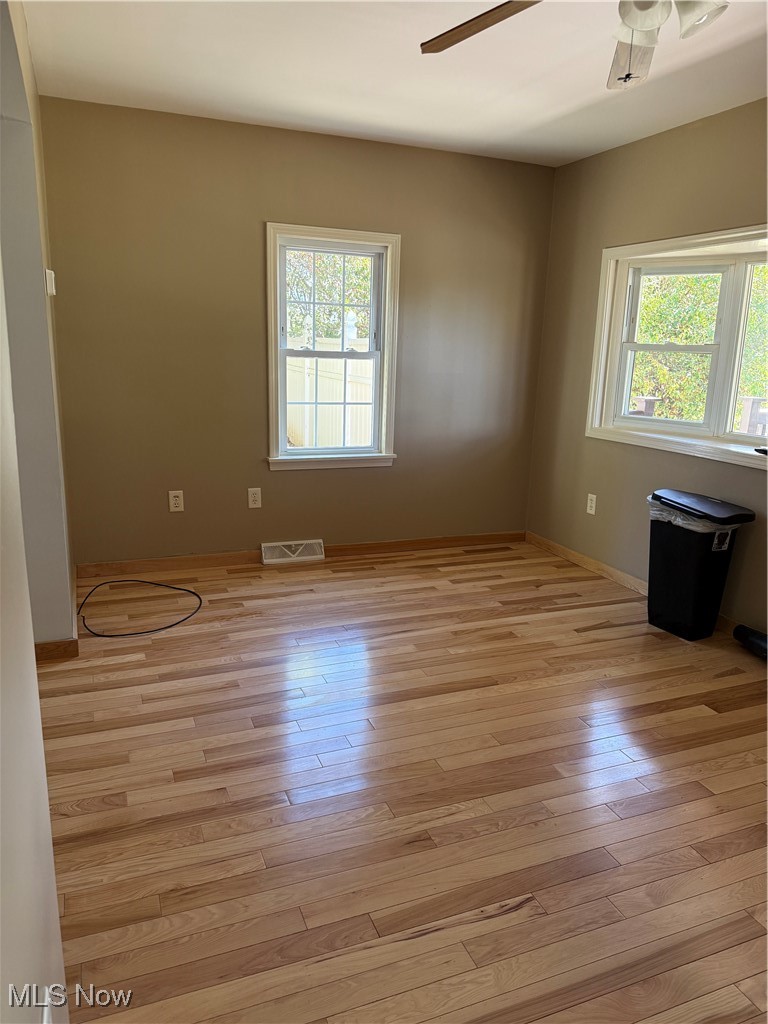 978 Center Road East Liverpool, OH 43920 - Photo 5 of 14 Unfurnished room with light wood-type flooring and a ceiling fan