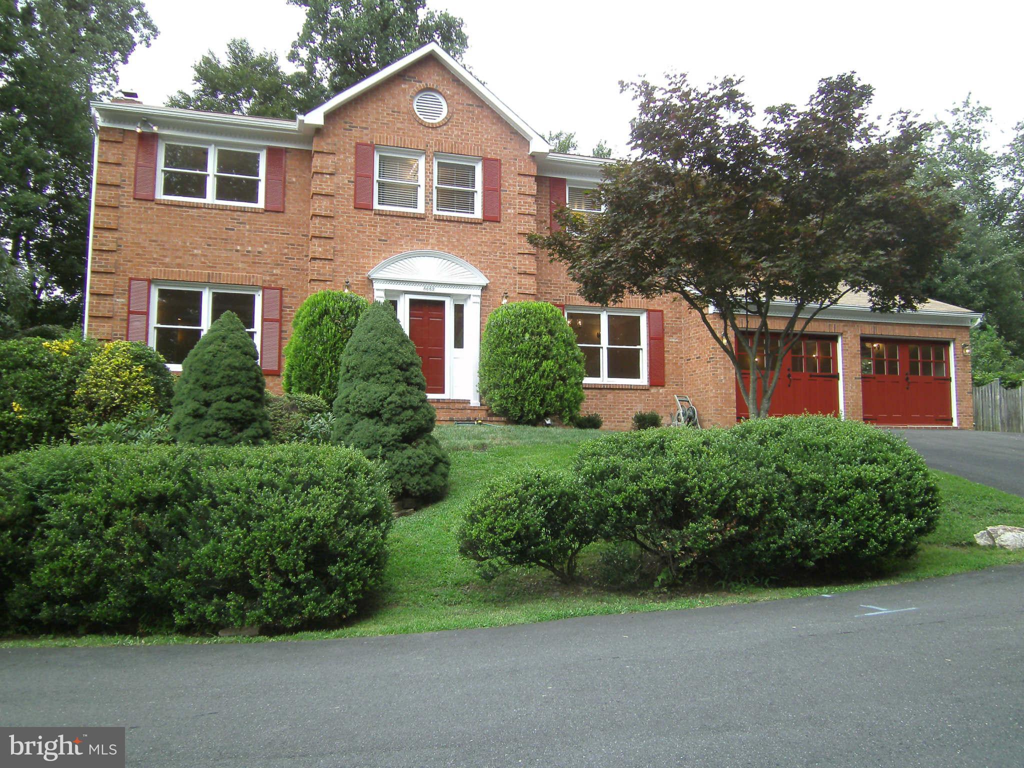 8662 Center Road Springfield, VA 22152 - Photo 1 of 23 a front view of a house with a yard