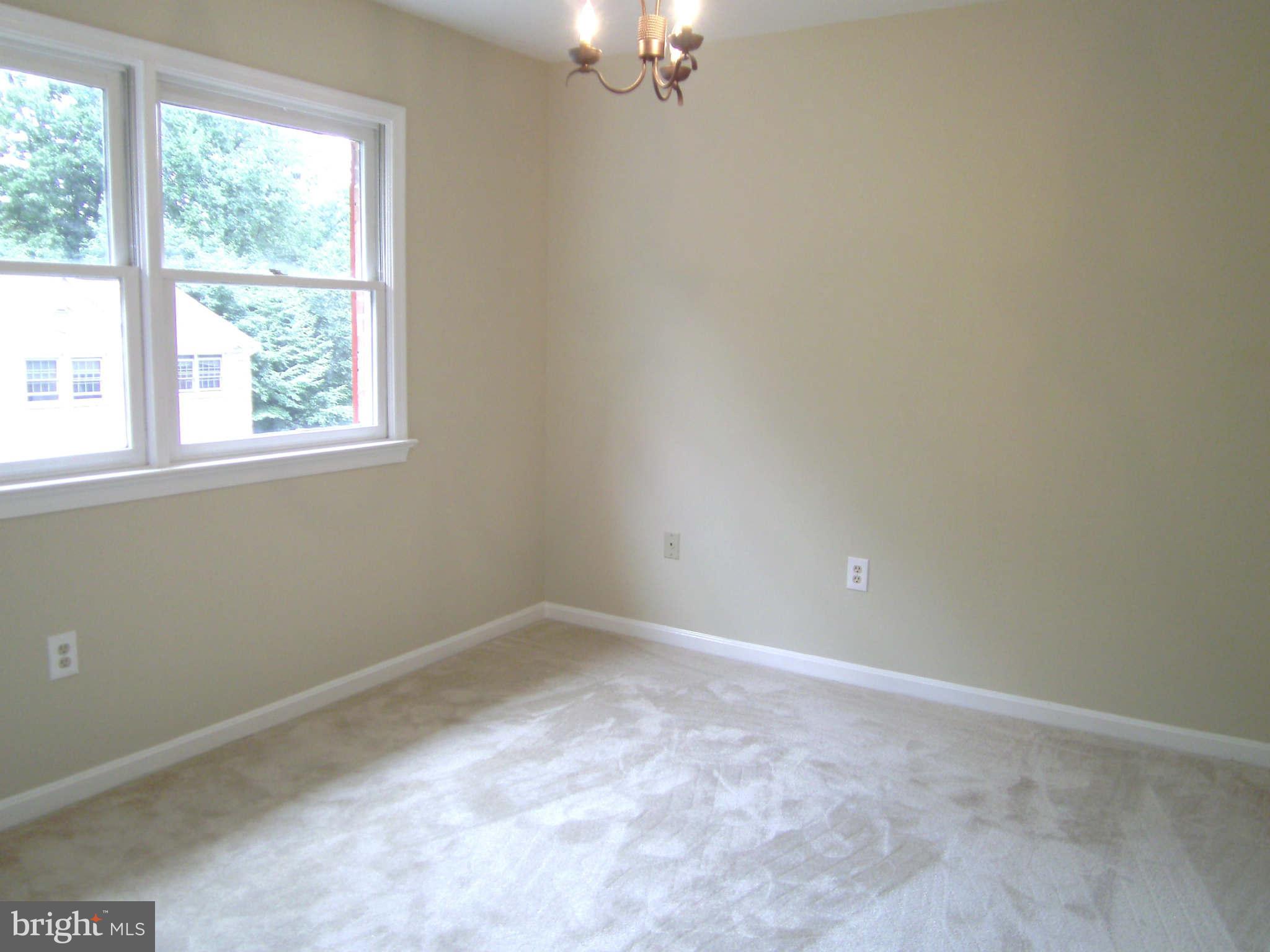 8662 Center Road Springfield, VA 22152 - Photo 11 of 23 an empty room with a window