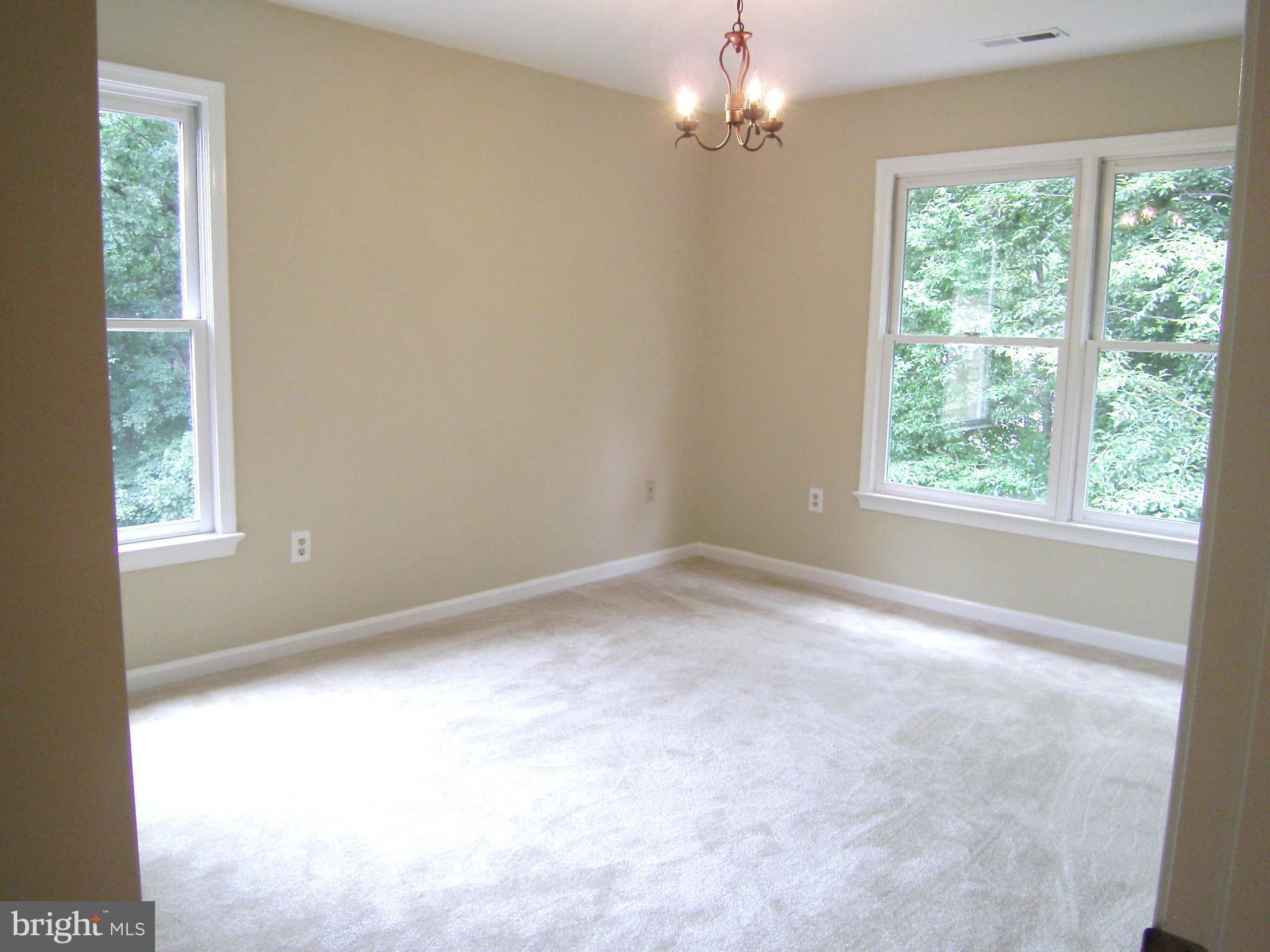 8662 Center Road Springfield, VA 22152 - Photo 12 of 23 a view of empty room with window