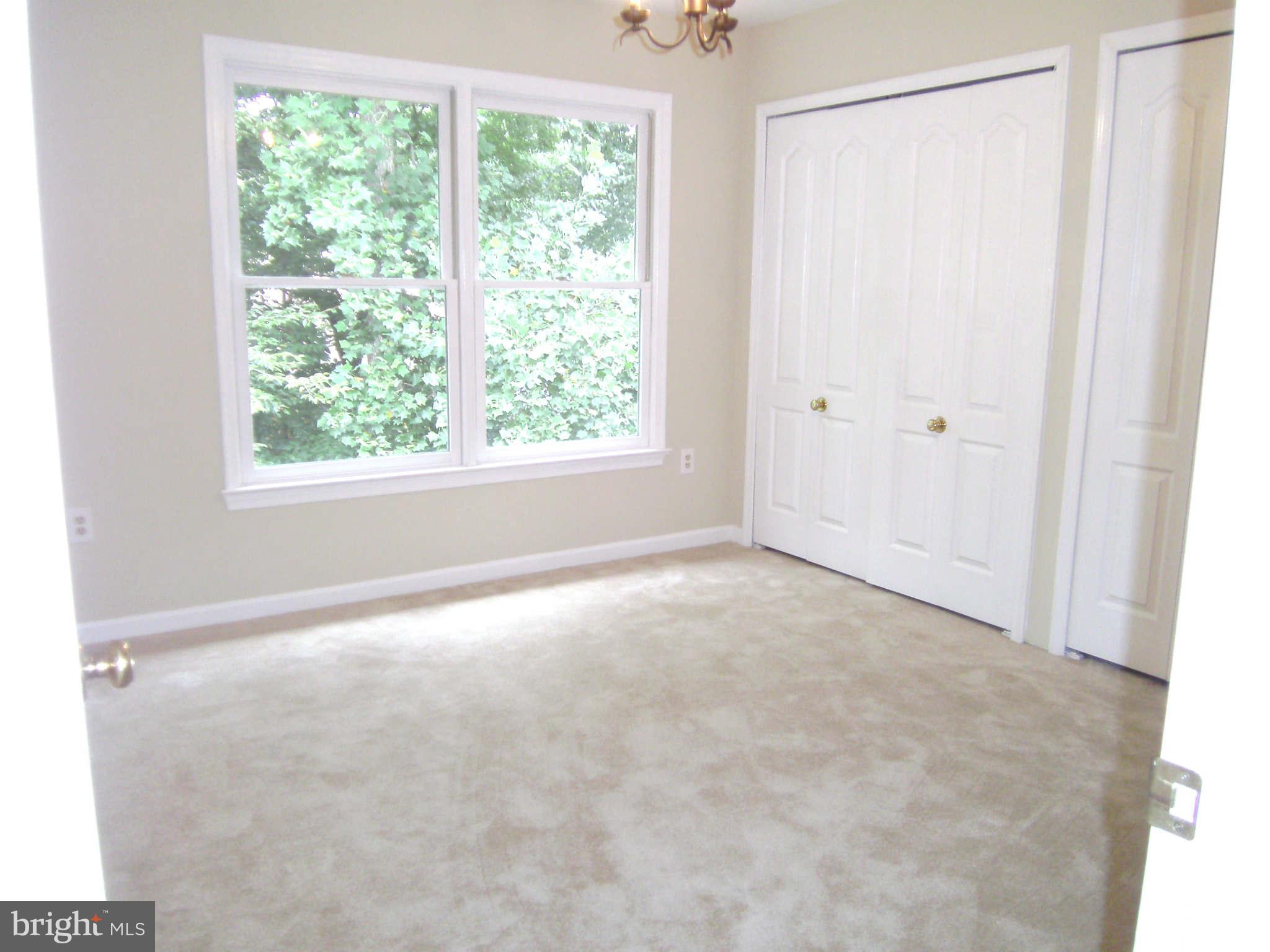 8662 Center Road Springfield, VA 22152 - Photo 13 of 23 a view of an empty room with a window
