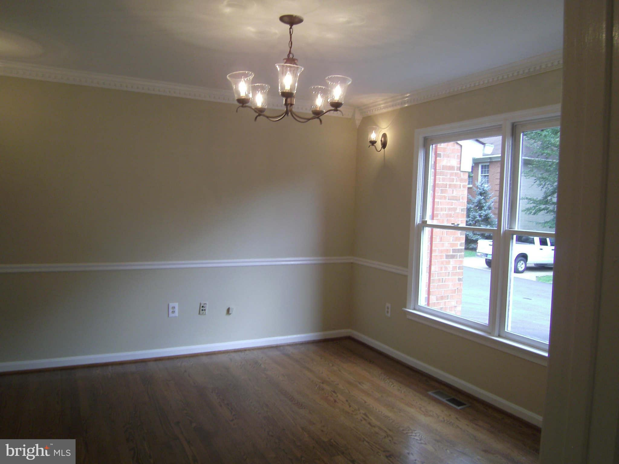 8662 Center Road Springfield, VA 22152 - Photo 4 of 23 a view of a room with windows and chandelier