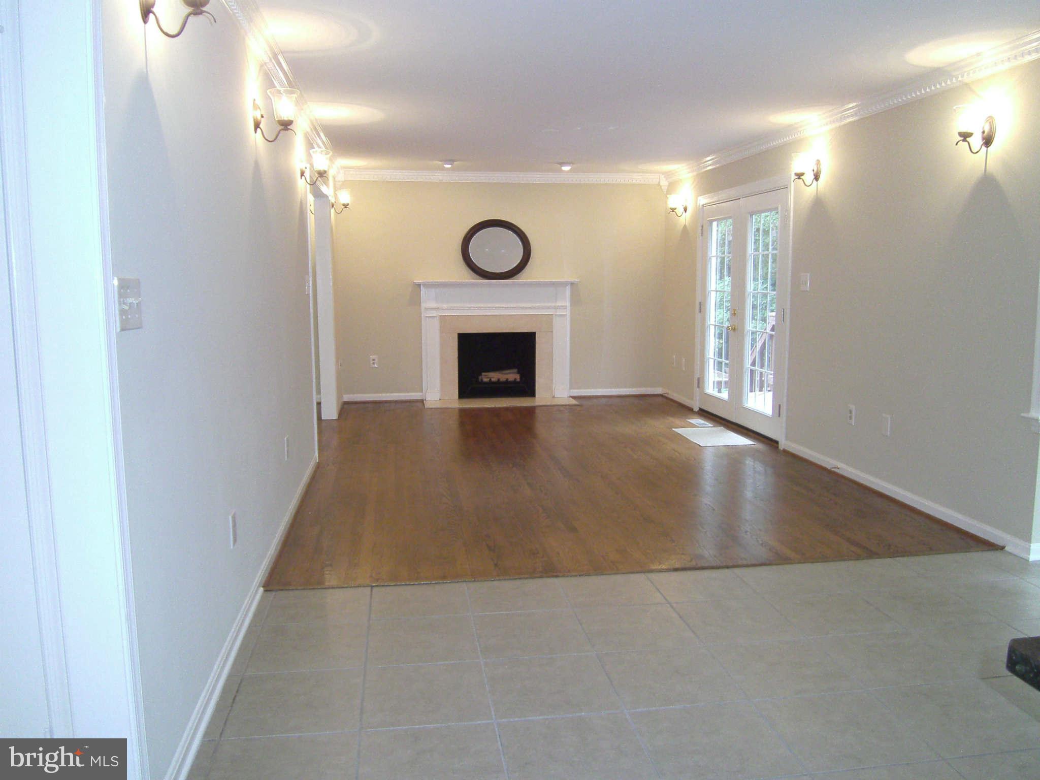 8662 Center Road Springfield, VA 22152 - Photo 7 of 23 a view of livingroom and fireplace