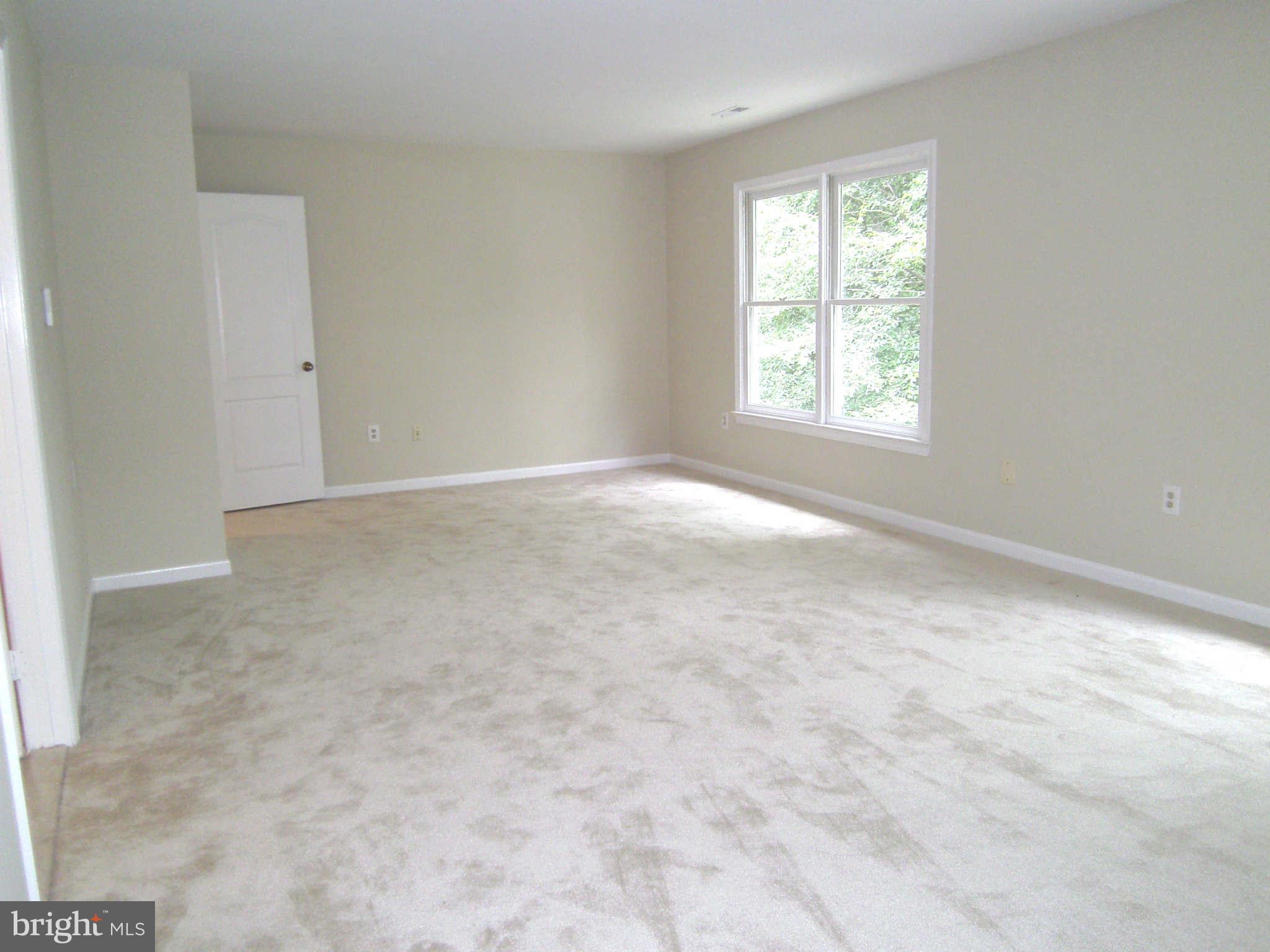 8662 Center Road Springfield, VA 22152 - Photo 8 of 23 an empty room with windows