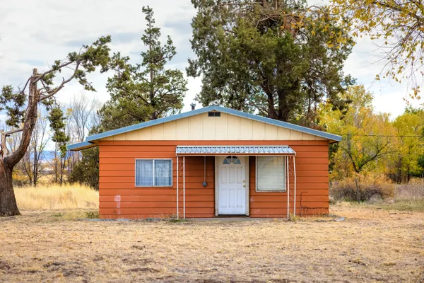 a front view of a house with a garage