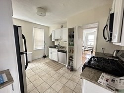 a kitchen with stainless steel appliances a refrigerator stove and sink
