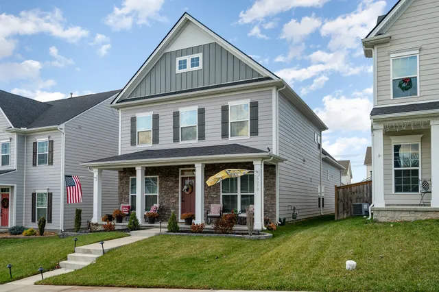 a front view of a house with a yard