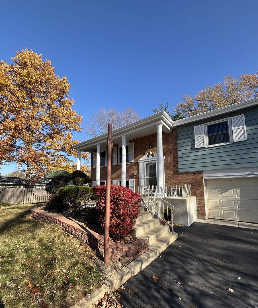 18745 Queens Road Homewood, IL 60430 - Photo 54 of 61 a front view of a house with a yard
