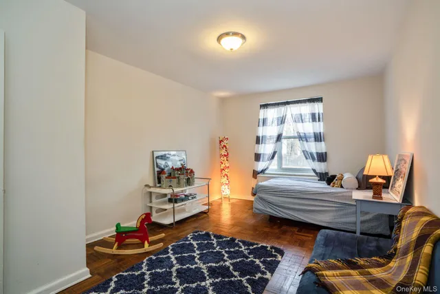 a bedroom with furniture and a window