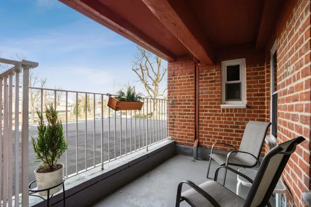 a view of balcony with furniture