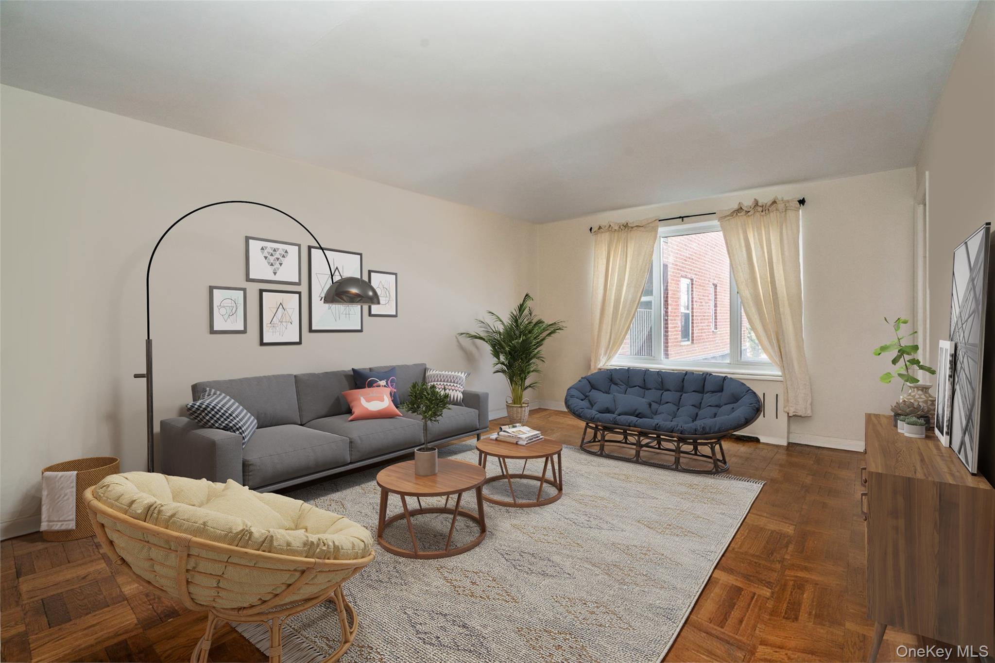565 Broadway, Unit 1F Hastings-on-Hudson, NY 10706 - Photo 3 of 17 a living room with furniture and a large window