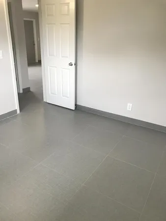 an empty room with mirror