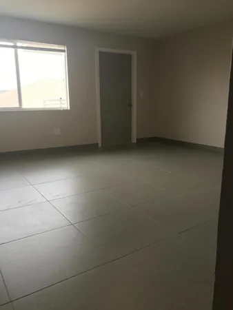 a view of a refrigerator in a room