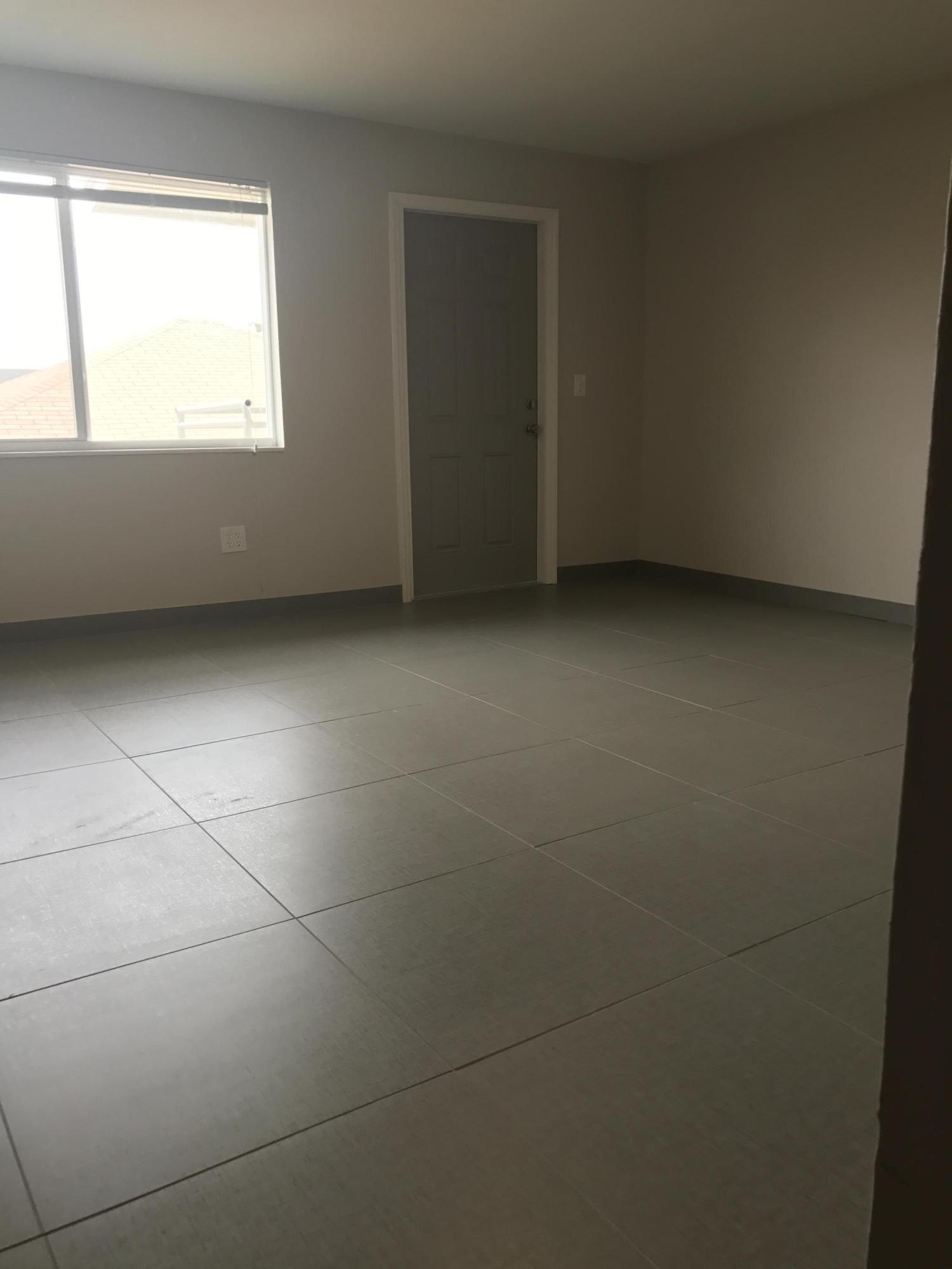 142 Southwest 8th Avenue, Unit B Delray Beach, FL 33444 - Photo 22 of 29 a view of an empty room with a window