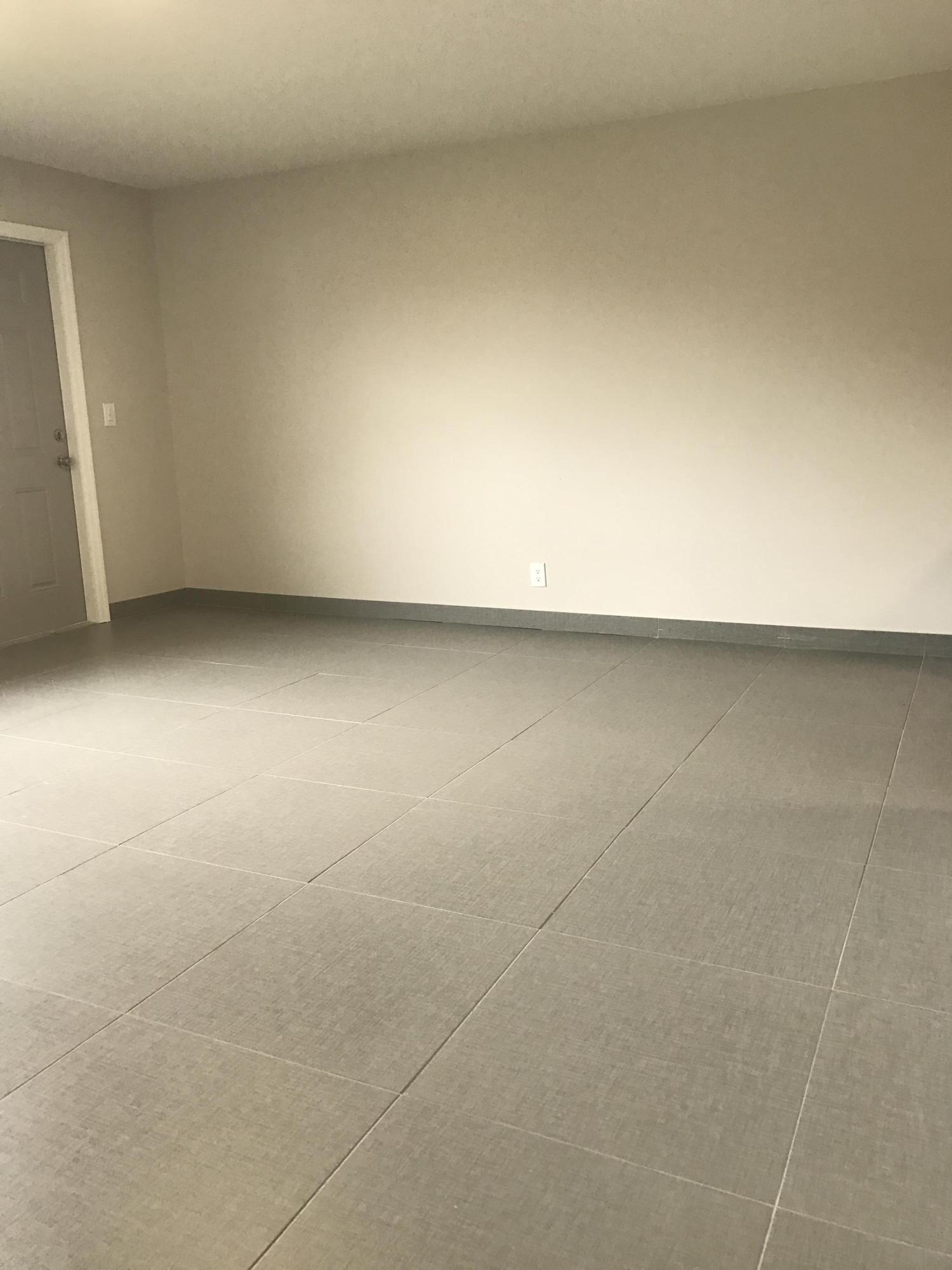 142 Southwest 8th Avenue, Unit B Delray Beach, FL 33444 - Photo 23 of 29 a view of a refrigerator in a room