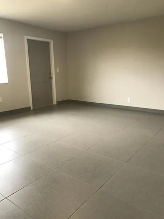 a view of an empty room and window