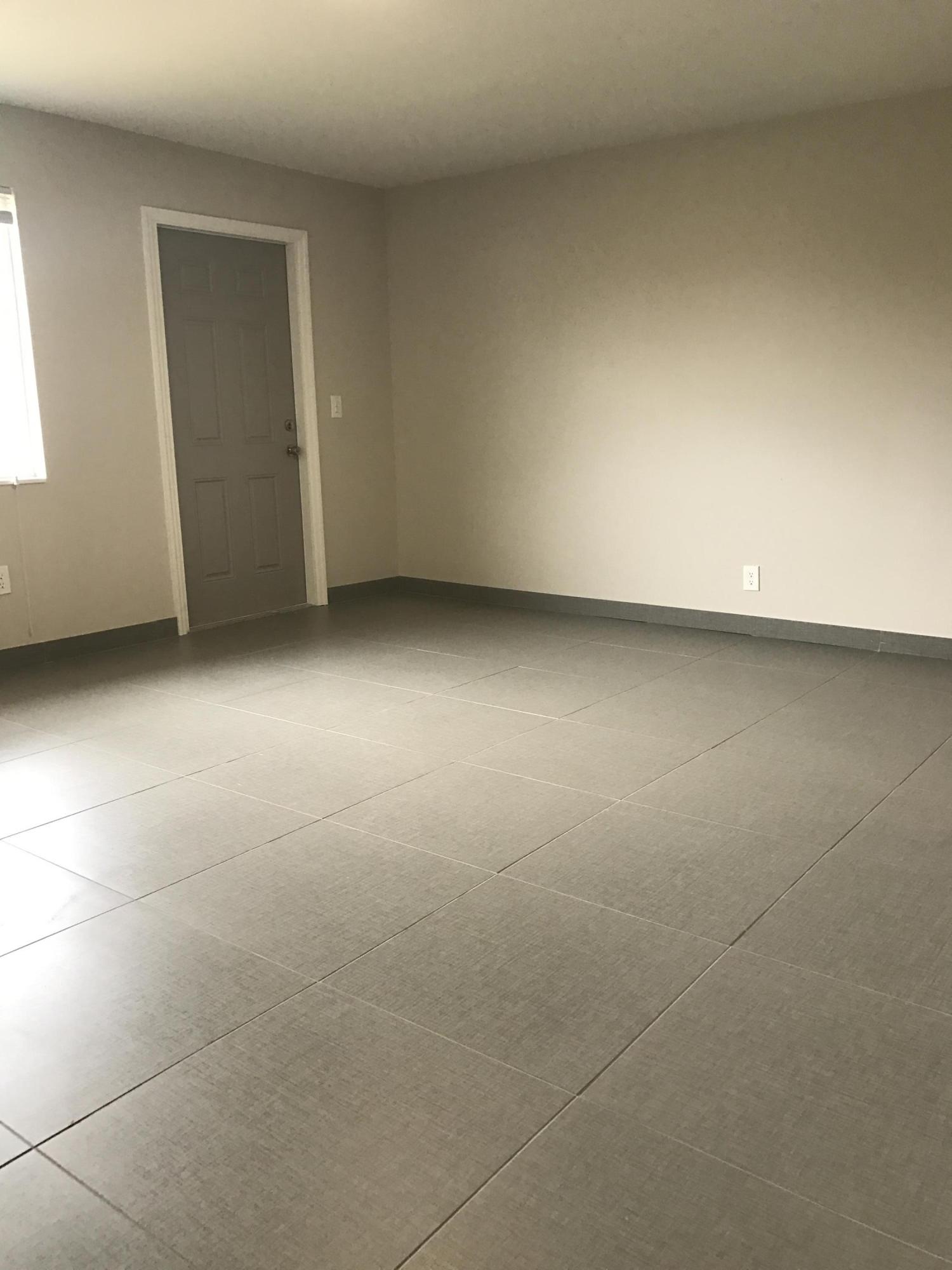 142 Southwest 8th Avenue, Unit B Delray Beach, FL 33444 - Photo 24 of 29 an empty room with a bench