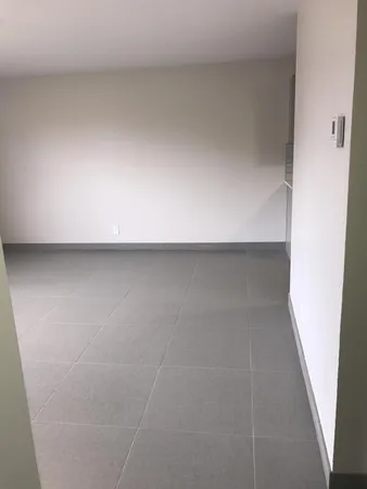 a view of an empty room with a window