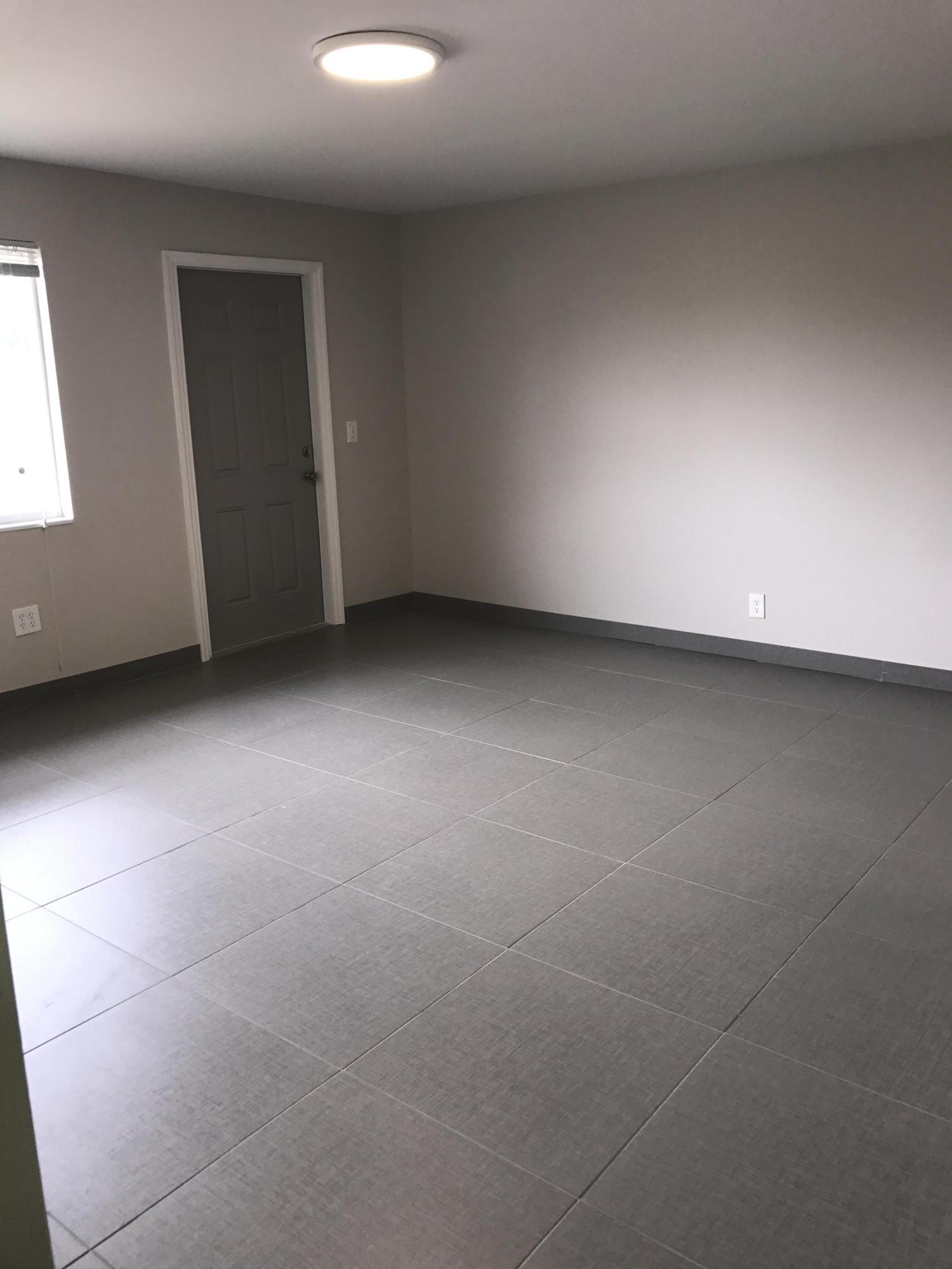 142 Southwest 8th Avenue, Unit B Delray Beach, FL 33444 - Photo 28 of 29 a view of an empty room with a window