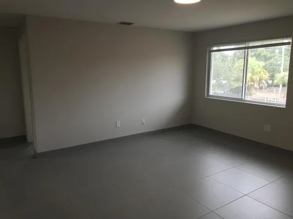 a view of an empty room with a window