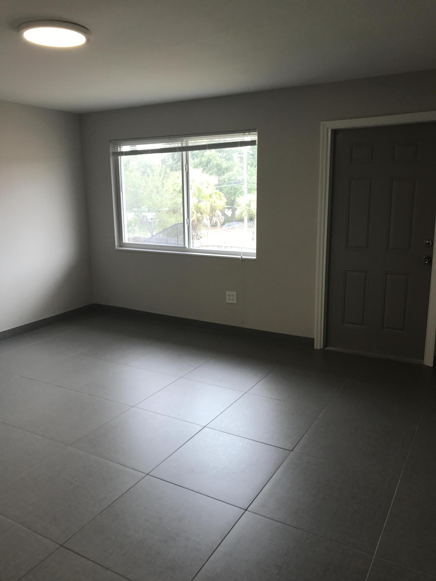 142 Southwest 8th Avenue, Unit B Delray Beach, FL 33444 - Photo 8 of 29 a view of an empty room with a window