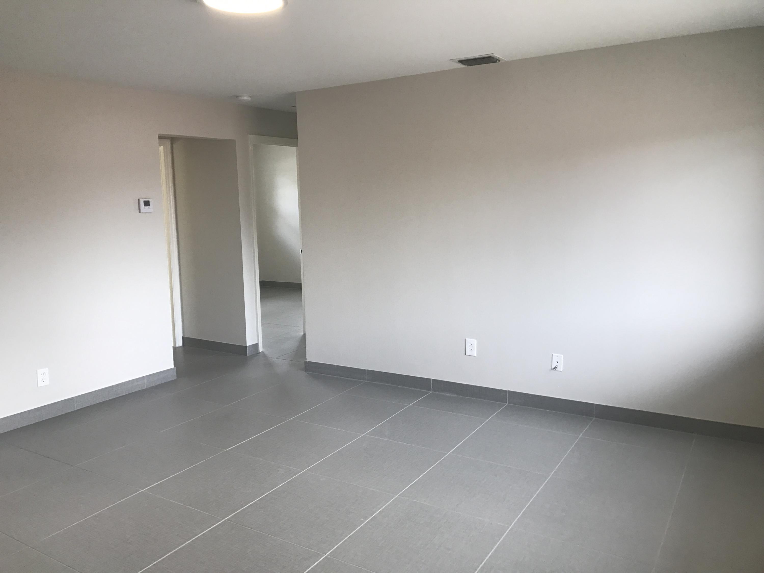 142 Southwest 8th Avenue, Unit B Delray Beach, FL 33444 - Photo 9 of 29 an empty room with a natural light