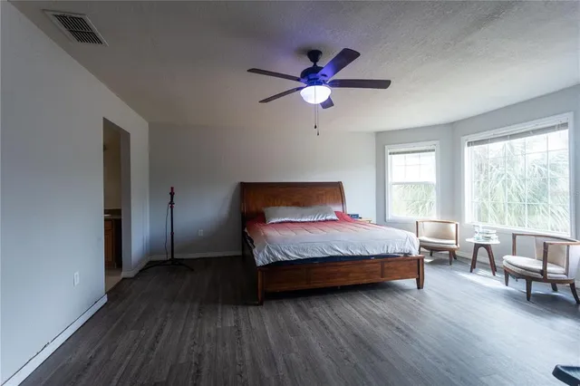 a living room with furniture fireplace and flat screen tv