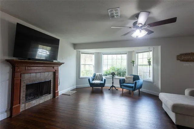 a view of staircase with wooden floor and white walls