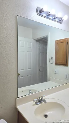 a bathroom with a sink and a bathtub
