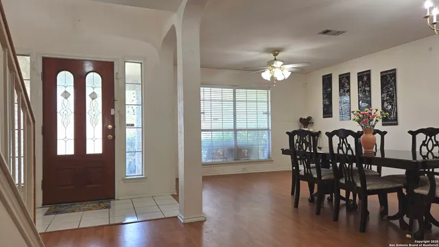 a view of a dining room with furniture window and wooden floor
