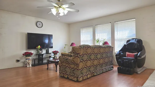 a living room with furniture and a window
