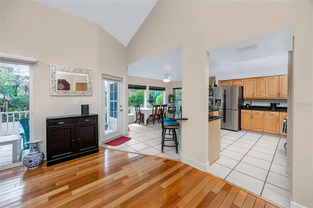 a kitchen with stainless steel appliances granite countertop a refrigerator stove top oven and sink