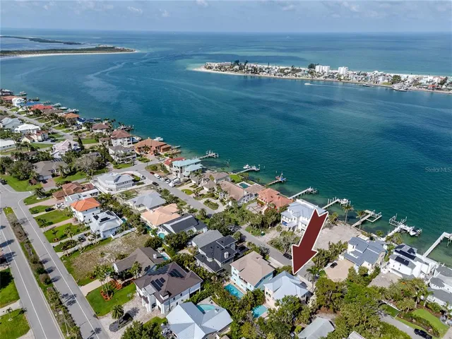 a kitchen with stainless steel appliances granite countertop a stove cabinets and wooden floor