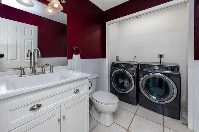 a view of a dining room with furniture and a bookshelf
