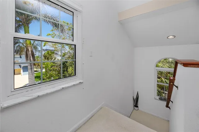 a view of a chair and tables in the patio
