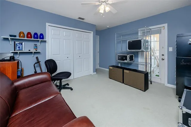 a view of empty room with furniture and window