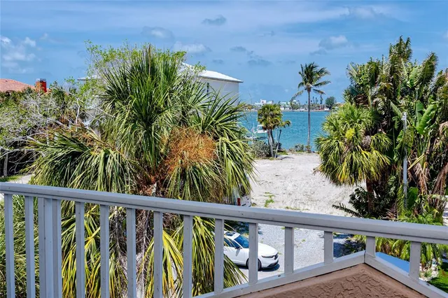 a view of a house with swimming pool and sitting area