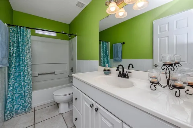 an aerial view of lake and residential houses with outdoor space