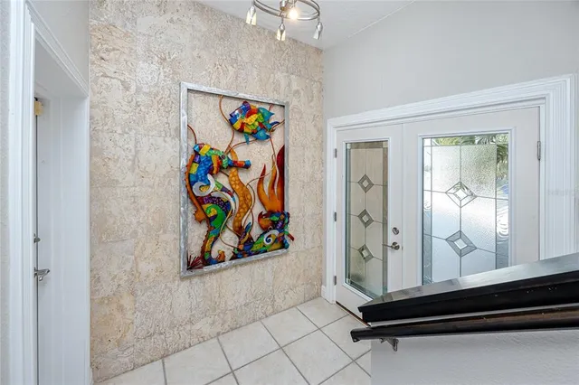 a living room with furniture and kitchen view