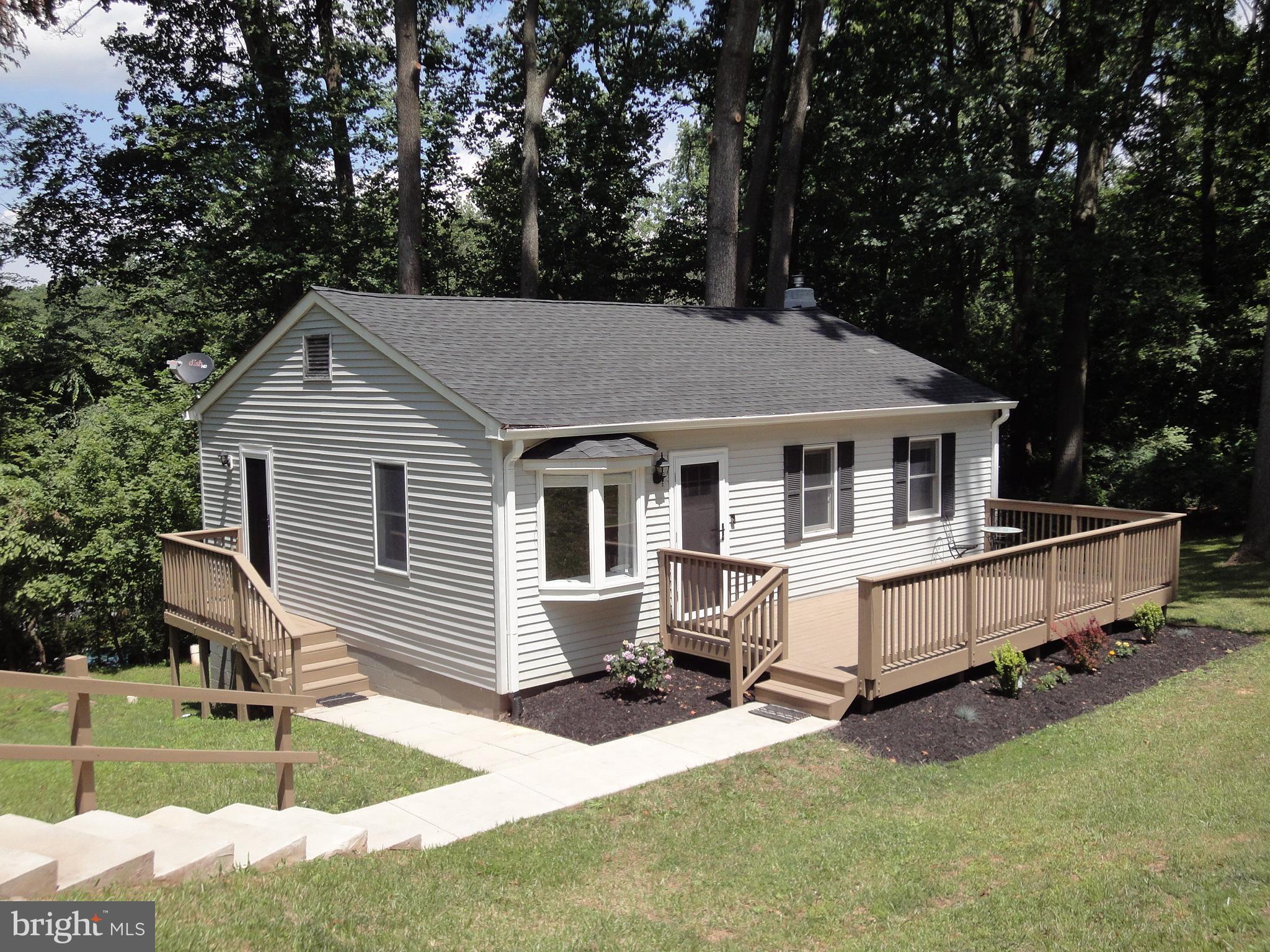 1618 Providence Road Towson, MD 21286 - Photo 1 of 30 a front view of a house with a yard