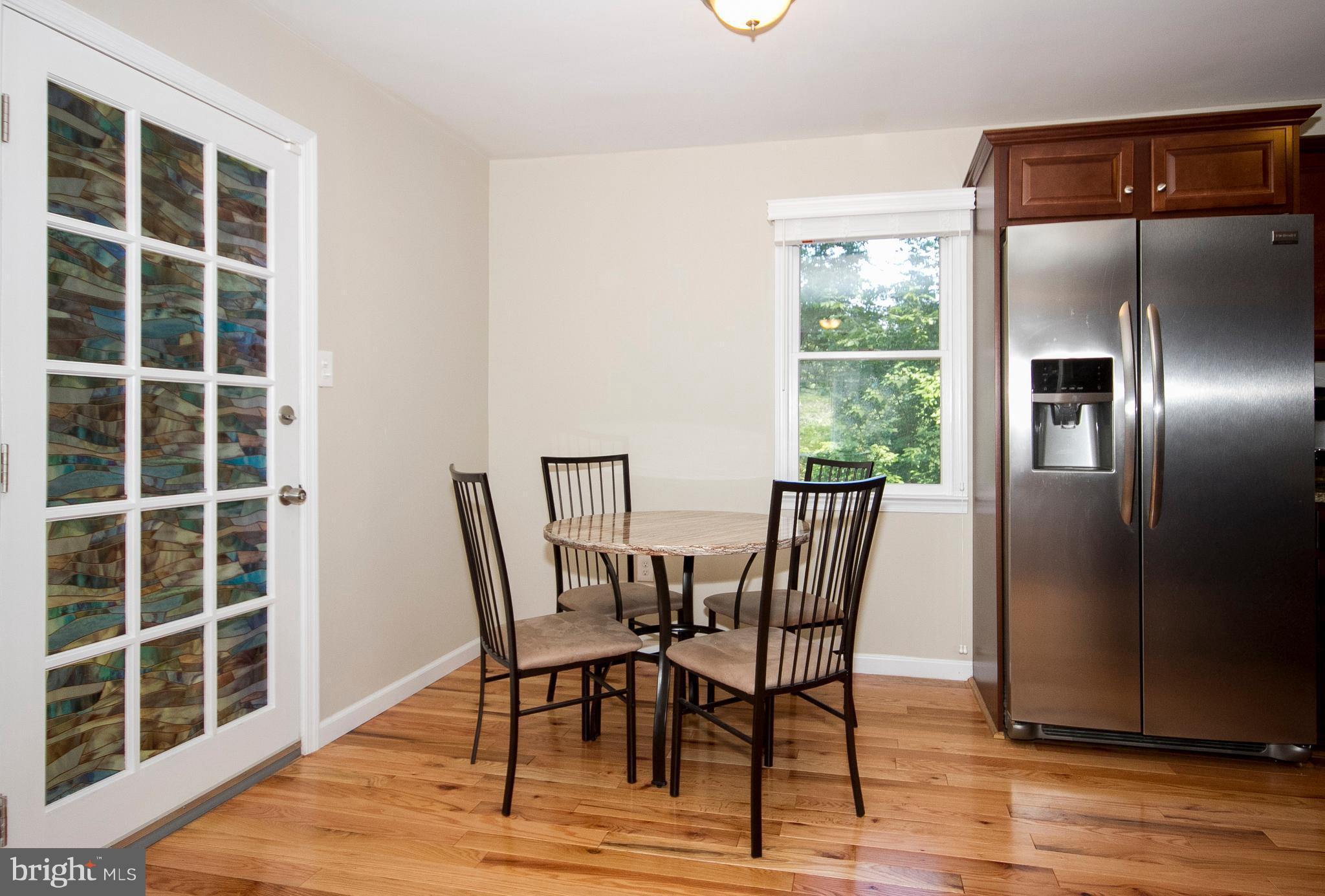 1618 Providence Road Towson, MD 21286 - Photo 12 of 30 a view of a dining room with furniture and wooden floor
