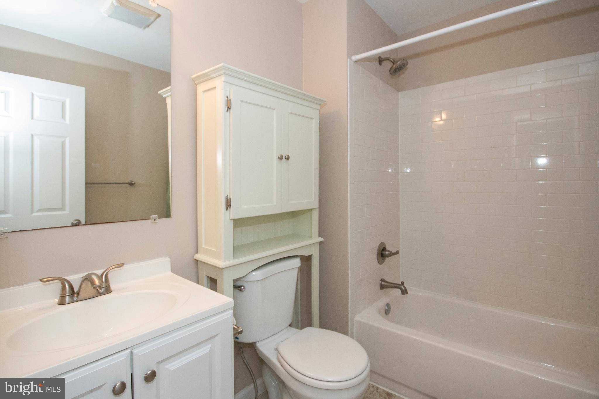 1618 Providence Road Towson, MD 21286 - Photo 14 of 30 a bathroom with a sink toilet vanity and shower