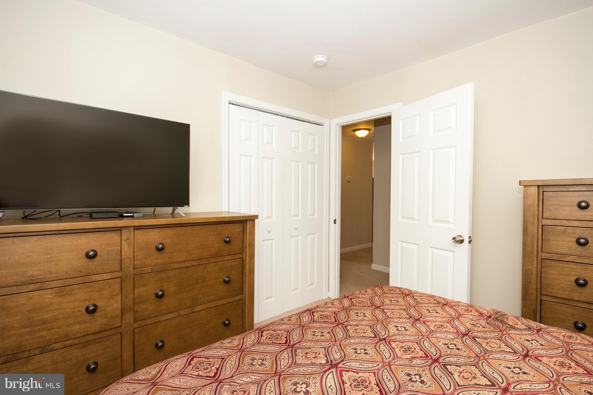 1618 Providence Road Towson, MD 21286 - Photo 16 of 30 a bedroom with a bed and a flat screen tv