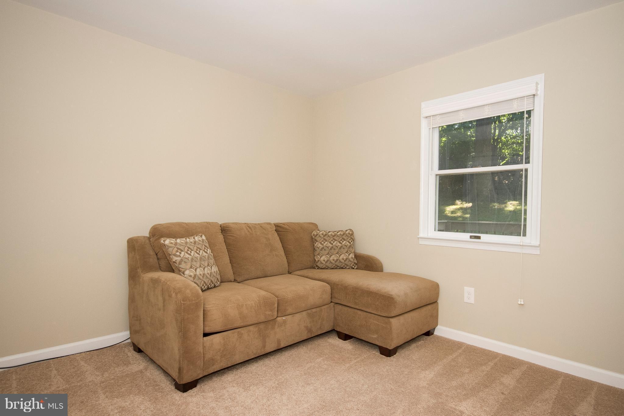 1618 Providence Road Towson, MD 21286 - Photo 17 of 30 a living room with furniture and a window